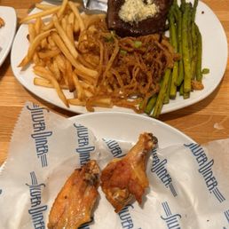 Flat Iton Local Flat Iron Steak, french fries, onion strings, asparagus and Buffalo Wings. Flat Iton Local Flat Iron Steak, french fries, onion strings, asparagus and Buffalo Wings.