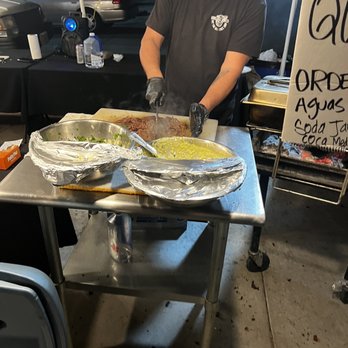 Tacos Placosos - a man preparing food - Tacos Near Me