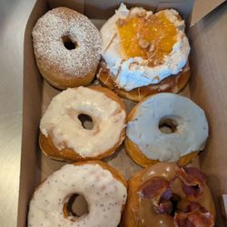 Sugar Shack Donuts & Coffee - French toast, peach, lemon poppy, maple bacon, lavender, and a peach cobler cinnamon bun. recommend the maple bacon and lemon poppy
