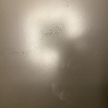 Omaha Marriott Downtown at the Capitol District - Water splatters and handprint that was not cleaned at checkin on bathroom pocket door - Hotels Near Me - Omaha, Nebraska