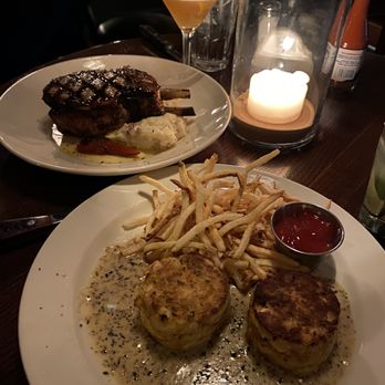 131 Main Restaurant - Double cut pork chop with red mashed potatoes and crab cakes with fries. - American Near Me - Asheville, North Carolina