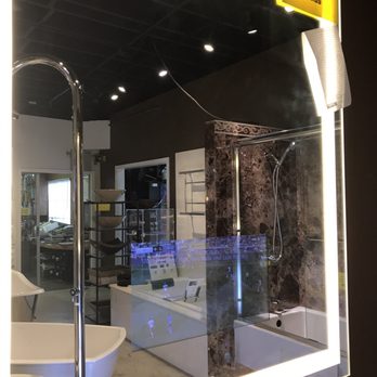 Reback's Plumbing N' Things - That's not a reflection of a TV.  It's a mirror with a built-in TV! - Plumbing Near Me - Gardena, California