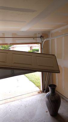 Garage door off track, call or text 214-466-9709 - This garage door came off track, rollers out and cables off. Our technician was able to get everything back as is should be and in full working order.