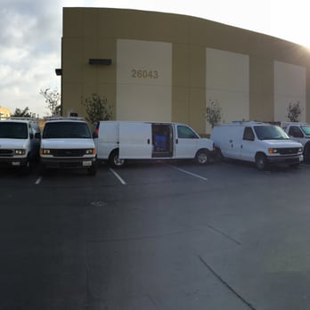 Right Stop Restoration - several vans parked in a parking lot - Damage Restoration Near Me - Murrieta, California