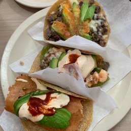 Left to right- Quesataco with arrecherra and shrimp jalapeño salseado New York and taco de nopal