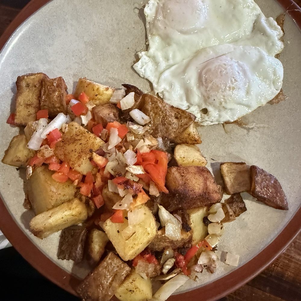 À la carte breakfast potatoes, and two eggs. À la carte breakfast potatoes, and two eggs.