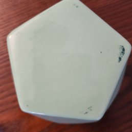 Mint lid with teal paint smudges. Mint lid with teal paint smudges.