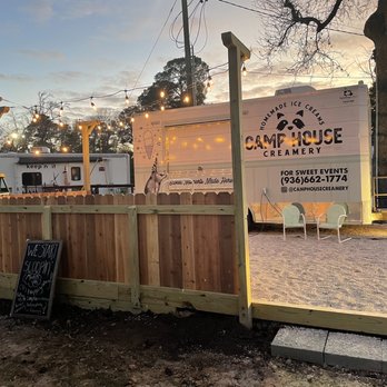 Camp House Creamery - a wooden fence with a sign for camp house creamery - Ice Cream & Frozen Yogurt Near Me - Huntsville, Texas