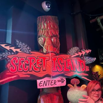 Secret Island - A sign to show where to go. Go downstairs and follow this sign. - Polynesian Near Me - Long Beach, California Secret Island - A sign to show where to go. Go downstairs and follow this sign. - Polynesian Near Me - Long Beach, California
