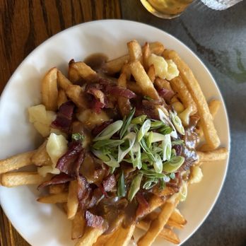 Bartholomews Pub - Poutine with bacon and green onion (gravy is awesome) - Pubs Near Me - Victoria, British Columbia Bartholomews Pub - Poutine with bacon and green onion (gravy is awesome) - Pubs Near Me - Victoria, British Columbia
