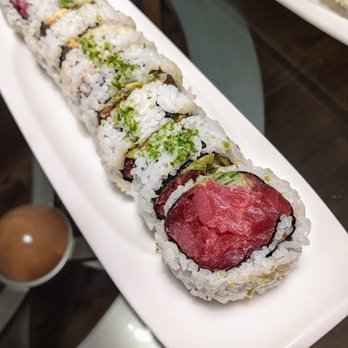 Noble Village  - Look at the massive Michigan roll filled with bright red Ahi tuna, a bit of cucumber and avocado. - Japanese Near Me - Clawson, Michigan