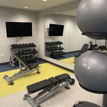 TownePlace Suites By Marriott - Little dumbbell and bench area - Hotels Near Me - Louisville, Kentucky TownePlace Suites By Marriott - Little dumbbell and bench area - Hotels Near Me - Louisville, Kentucky