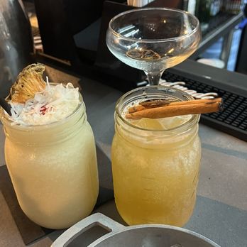 La Picadera Bar & Restaurant - Piña colada on the left, and the Fuego N el 23 - Puerto Rican Near Me - San Juan, Puerto Rico