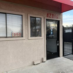 CubeSmart Self Storage - photo showing open sign, doors locked during business hours, no sign of 'will be back'.