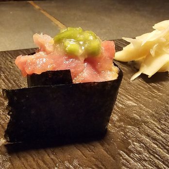 Sushi by Bou - Albany NY @ City Beer Hall - a piece of sushi on a chopping board - Sushi Bars Near Me - Albany, New York Sushi by Bou - Albany NY @ City Beer Hall - a piece of sushi on a chopping board - Sushi Bars Near Me - Albany, New York