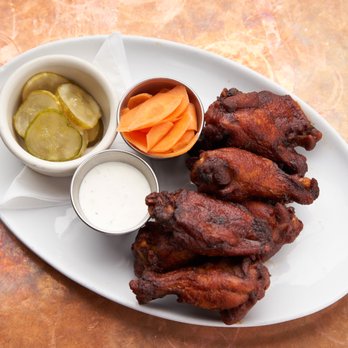 Secret Sauce - a plate of chicken wings, carrots, and pickles - Southern Near Me Secret Sauce - a plate of chicken wings, carrots, and pickles - Southern Near Me
