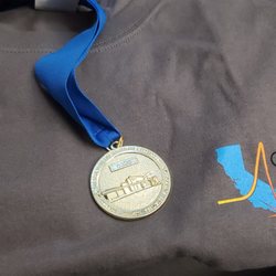 California Protons Cancer Therapy Center - The Gold Medal weighs 5 POUNDS !!!!