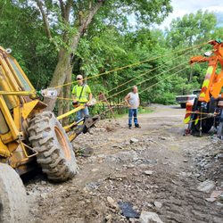 JK Towing - JK Towing's trained operators safely recover this machine from a precarious location after a landslide occurred.