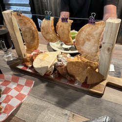 Trading Post Pub on Main - Trading post sampler (one chicken and one steak empanada, 4 wings, 2 mozzarella triangles, one cheese quesadilla and 2 homemade pierogies
