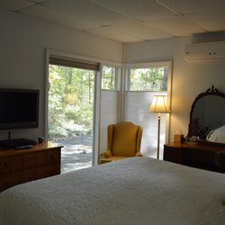 Inn the Woods Bed & Breakfast - Cliffside Room letting the view in.