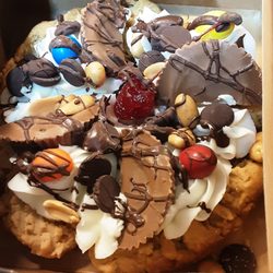 Tasty Bakies & Gifts - 6" PeanutButter pattie party cake with a variety of different candies for your special someones celebration.