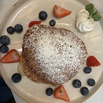 Sunny's at The RIM - Berry pancake stack = three light pancakes with layers of fresh cream, blueberries, and strawberries! So yummy!!! - Breakfast & Brunch Near Me - San Antonio, Texas Sunny's at The RIM - Berry pancake stack = three light pancakes with layers of fresh cream, blueberries, and strawberries! So yummy!!! - Breakfast & Brunch Near Me - San Antonio, Texas