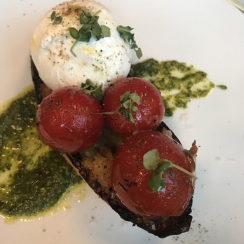 Sixty Vines - Burrata on top of a toast with tomato & pesto sauce is delicious - New American Near Me - Dallas, Texas