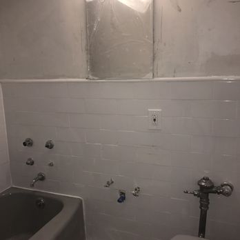 A Good Handyman - Finished wall tile. The light and shadow show a little unevenness. - Handyman Near Me - Chicago, Illinois