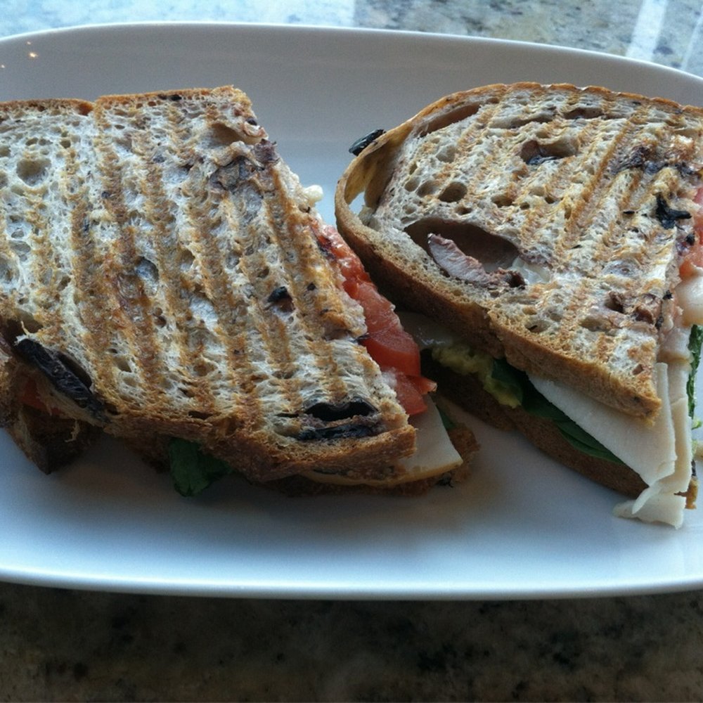 Smoked turkey and asiago on black olive bread.