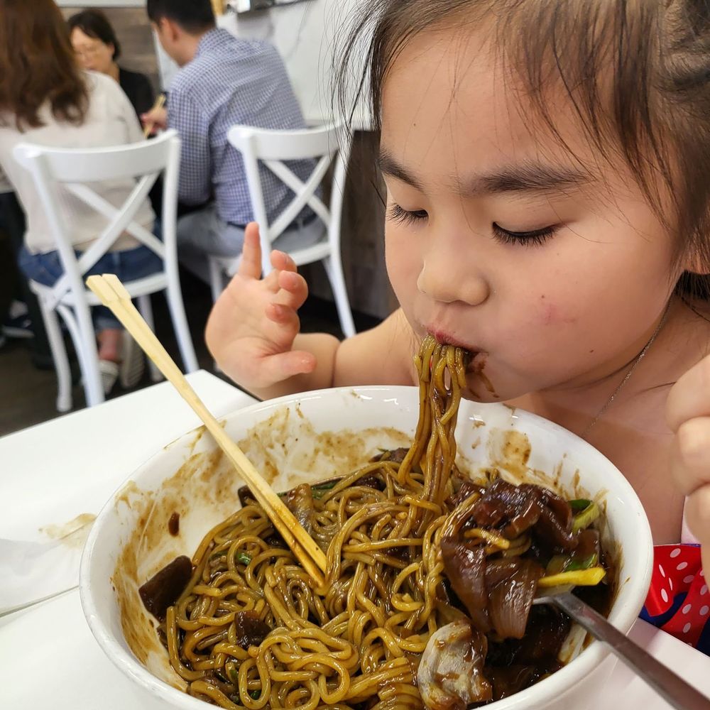 Yoo's Place - Luna absolutely demolishing an adult-sized bowl like it owes her money. - Korean Near Me - Irvine, California