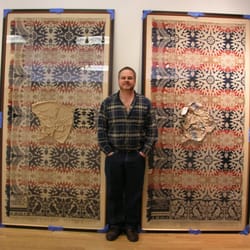 Gregory James Gallery - Greg next to framed textile.