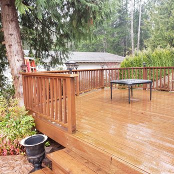 4th Dimension Construction - a deck with a table and chairs - General Contractors Near Me - Tumwater, Washington 4th Dimension Construction - a deck with a table and chairs - General Contractors Near Me - Tumwater, Washington