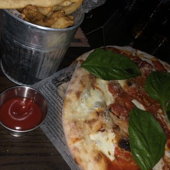 Copper Blues Rock Pub & Kitchen - Fries and margarita pizza - Bars Near Me - Doral, Florida