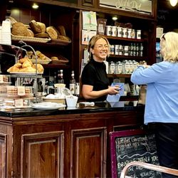Stable Diet Café - I love that welcoming smile -- and the beautiful bread and pastries.