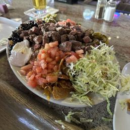The nachos here are incredible! Sorry for the mess I started into them before taking this picture. You'll make a mess, no way around it. The nachos here are incredible! Sorry for the mess I started into them before taking this picture. You'll make a mess, no way around it.