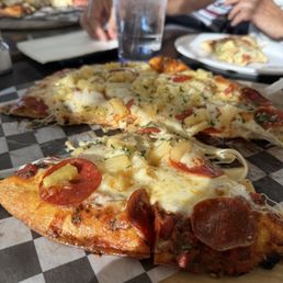 Pepperoni and pineapple pizza