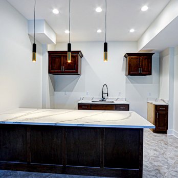 GCU Custom Builders - a kitchen with marble counter tops - General Contractors Near Me GCU Custom Builders - a kitchen with marble counter tops - General Contractors Near Me