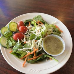 Small side salad frsh garden greens and under $4.00 Great home made dressings too!