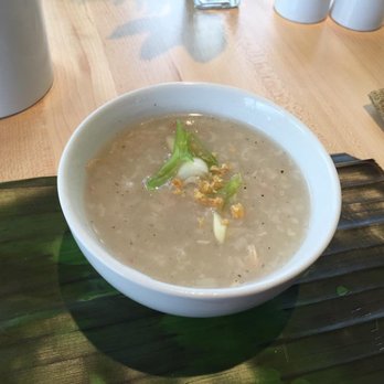 Bonifacio - A warm bowl of Arroz Caldo, a Chicken and rice porridge topped with fried garlic, and scallions. If you try anything, try this. - Filipino Near Me - Columbus, Ohio