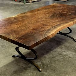 Claro walnut dining table with metal infinity legs