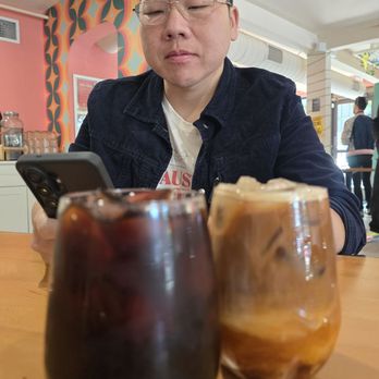 Sapha Kafae - My friend looking at his phone getting ready to post about the coffees were about to drink LOL - Cafes Near Me - Sacramento, California