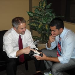 Oviedo Premier Dental - Dr. Simpson and Dr. Azer discussing a case