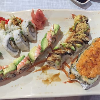 Akashi - From left to right: spider roll, tiger roll, sweet dragon roll and volcano roll (topped with scallops, so delicious!) - Sushi Bars Near Me - Durham, North Carolina Akashi - From left to right: spider roll, tiger roll, sweet dragon roll and volcano roll (topped with scallops, so delicious!) - Sushi Bars Near Me - Durham, North Carolina