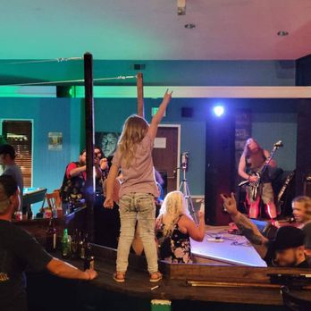 The Game Room - a woman standing on a table with her arms in the air - Pool Halls Near Me - Sonora, California The Game Room - a woman standing on a table with her arms in the air - Pool Halls Near Me - Sonora, California