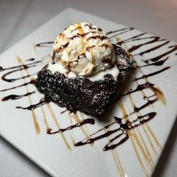 La Famiglia - Homemade Caramel Brownie Served with 2 Scoops of Nastos Vanilla Ice Cream