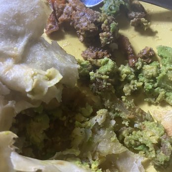Chicana - Trying to pick the guac I didn't ask for out of the expensive burrito. - Vegan Near Me - Fullerton, California