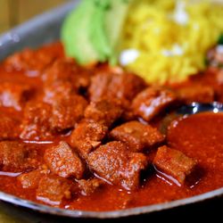 El Mezquite Market - Pork Meat with Red Chile, Rice and Beans.