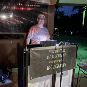 Archerway DJ & Karaoke - a man standing behind a microphone - Karaoke Near Me Archerway DJ & Karaoke - a man standing behind a microphone - Karaoke Near Me