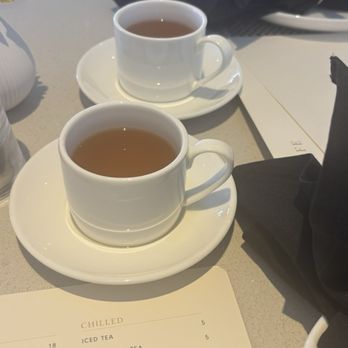 NM Café - Chicken broth to start that they bring out to help with digestion - New American Near Me - Las Vegas, Nevada