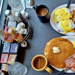 The Neighborhood Café - Above are eggs, hash browns, and coffee while below are cornbread pancakes, ham, scrambled eggs and coffee (mine). This is by the window.